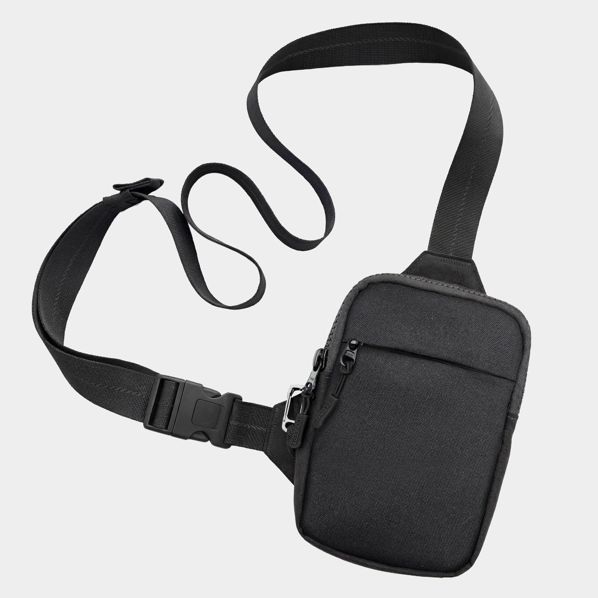 Travel Sling Bag 2.0 in black with an adjustable strap on a light gray background